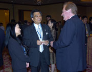 Mr Daniel LI, Deputy Commissioner, and Miss Rebecca LI, Chairman, Symposium Organizing Committee, greeted a delegate.