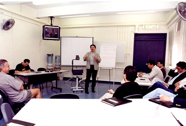 Mr Chu (middle) conducts a presentation at the ICAC Training Camp
