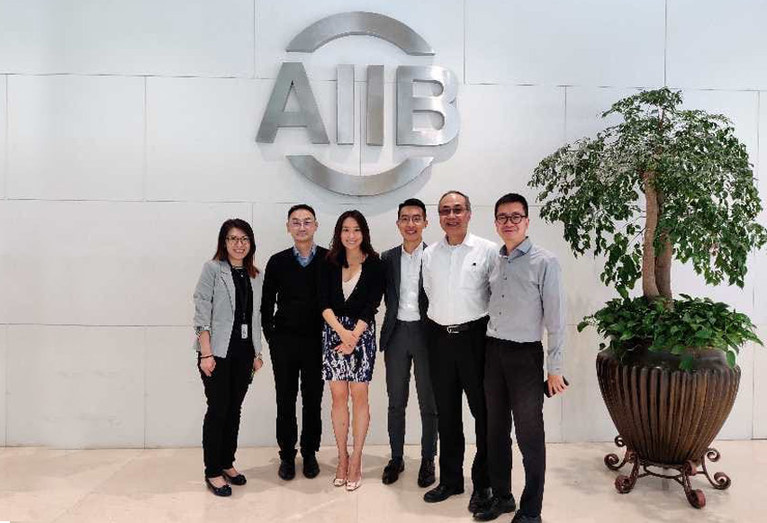 Mr Tse (2nd from the right) and his Hong Kong colleagues from AIIB’s various units