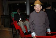 A delegate posed for a picture on a rickshaw